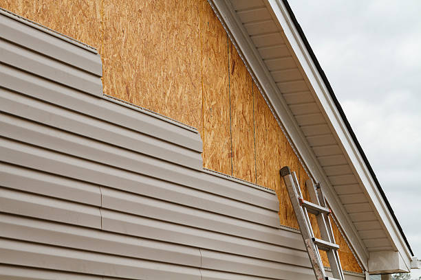 Professional Emergency Siding Repair technician working in Medfield, MA